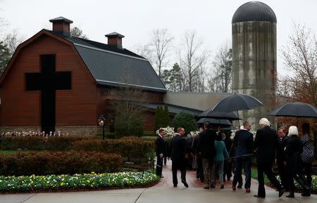The casket containing the late U.S. evangelist Billy Graham is received by his family and others at the Billy Graham Library in Charlotte, North Carolina, U.S. March 1, 2018. REUTERS/Leah Millis