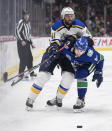St. Louis Blues' Robert Bortuzzo (41) is checked by Vancouver Canucks' Tyler Motte (64) during the first period of an NHL hockey game in Vancouver, British Columbia on Monday Jan. 27, 2020. (Darryl Dyck/The Canadian Press via AP)