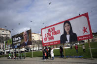 Birds fly above election campaign billboards for leftist parties in Lisbon, Portugal, Saturday, Feb. 24, 2024. The official two-week campaign period before Portugal's snap general election begins Feb. 25, with the country's two moderate mainstream parties once again expected to collect most votes but with the possible rise of a populist party potentially adding momentum to Europe's drift to the right. (AP Photo/Armando Franca)