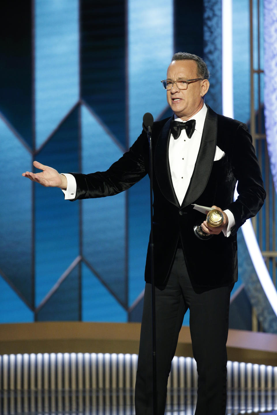 This image released by NBC shows Tom Hanks accepting the Cecil B. DeMille Award at the 77th Annual Golden Globe Awards at the Beverly Hilton Hotel in Beverly Hills, Calif., on Sunday, Jan. 5, 2020. (Paul Drinkwater/NBC via AP)