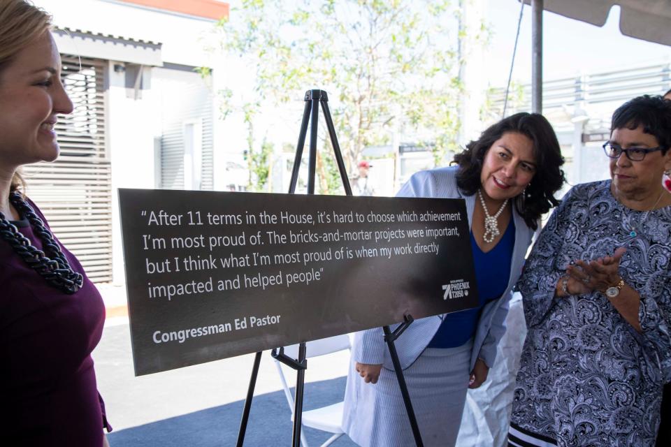 Phoenix Mayor Kate Gallego (left) with Phoenix Councilwoman Laura Pastor (right) and her mother Verma Pastor (far right) helped unveil a plaque in 2019 featuring a quote from former Congressman Ed Pastor at a light rail station named in his honor.