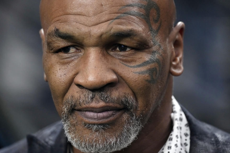 FILE - Former heavyweight boxing champion Mike Tyson stands on the field before an NFL football game between the Las Vegas Raiders and the Pittsburgh Steelers, Sept. 24, 2023, in Las Vegas. When New York's Adult Survivors Act expired on Friday, Nov. 24, more than 3,700 legal claims had been filed, with many of the last few coming against big-name celebrities, such as Tyson, and a handful of politicians. (AP Photo/Mark J. Terrill, File)