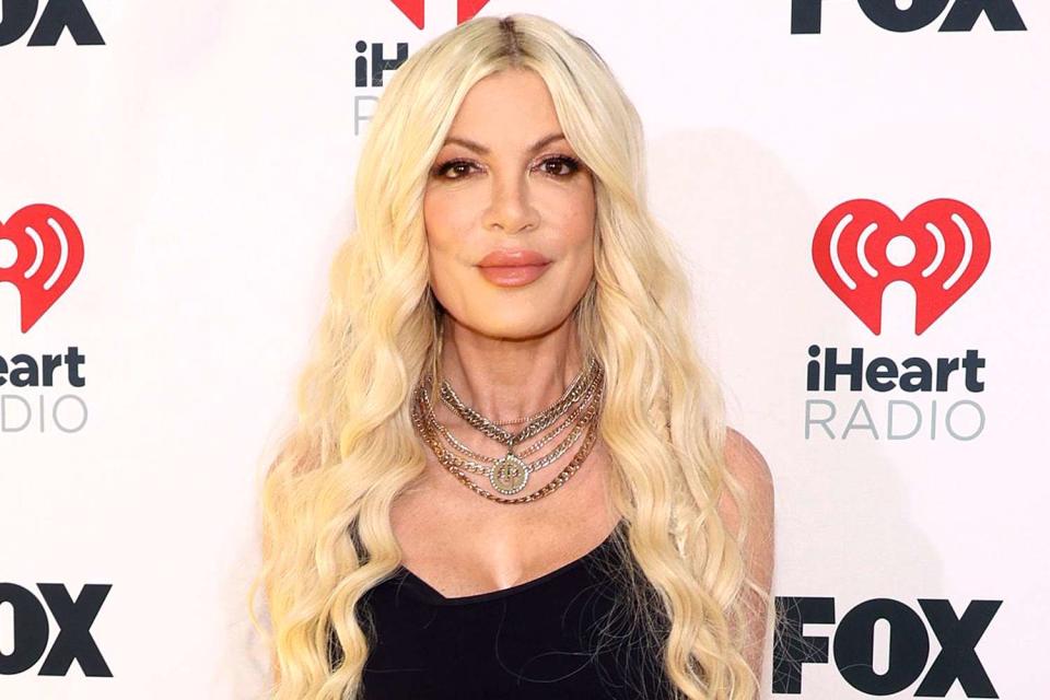 <p>Jesse Grant/Getty</p> Tori Spelling attends the 2024 iHeartRadio Music Awards at Dolby Theatre in Los Angeles, California on April 1, 2024.