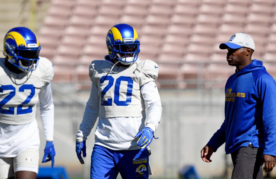 PASADENA, CA - FEBRUARY 10: Corner back David Long #22 and free safety Eric Weddle #20 of the Los Angeles Rams talk with defensive coordinator Raheem Morris during practice in preparation for the Super Bowl LVI at the Rose Bowl Stadium on February 10, 2022 in Pasadena, California. The Rams play the Cincinnati Bengals on Sunday. (Photo by Kevork Djansezian/Getty Images)