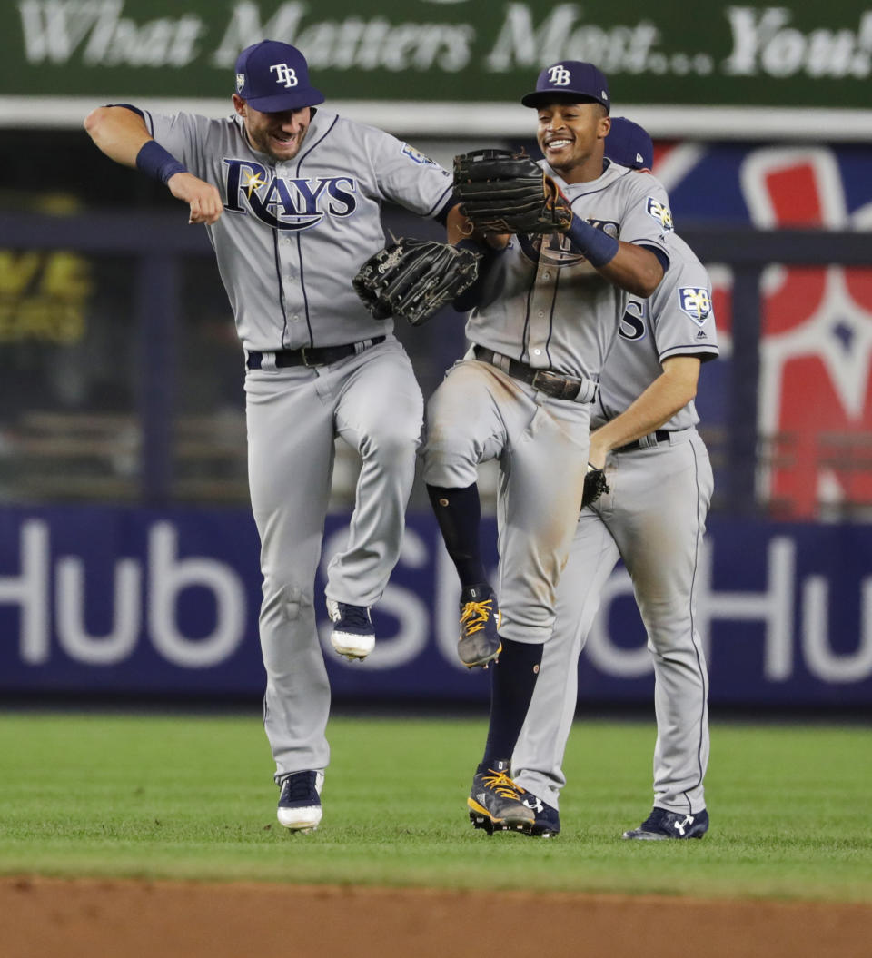 Tampa Bay Rays' Kevin Kiermaier, left, celebrates with Mallex Smith after the team's 6-1 win in a baseball game against the New York Yankees on Wednesday, Aug. 15, 2018, in New York. (AP Photo/Frank Franklin II)