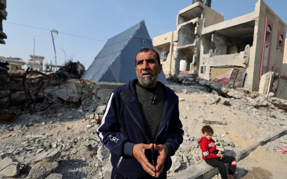 A Palestinian man Hamada whose wife, all of his six children and two grandchildren were killed in an Israeli strike that destroyed his house