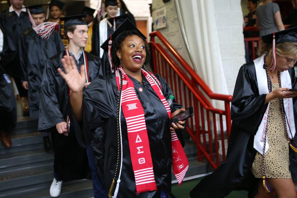 Graduates enter Mitchell Center for Denison University's commencement on May 18, 2019.