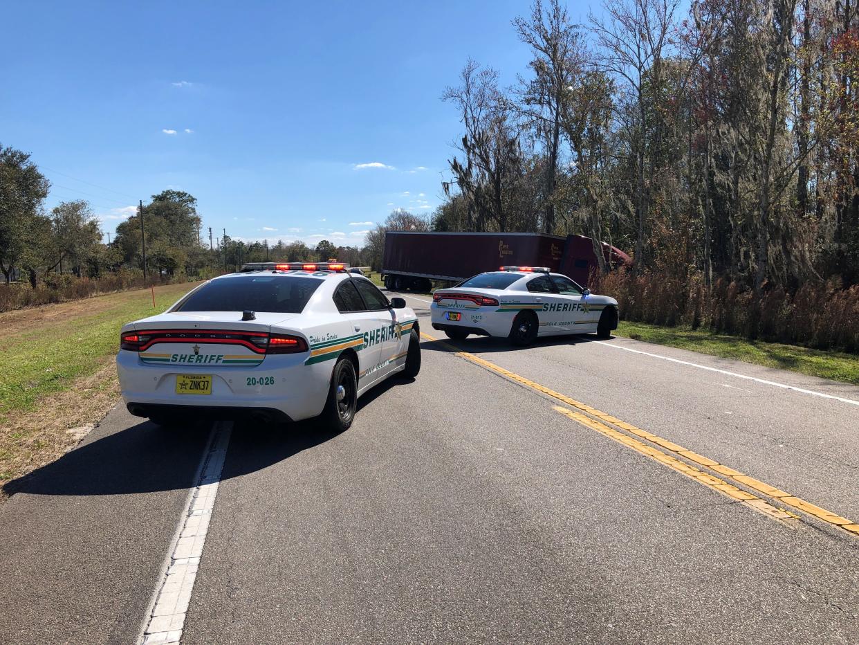 A 49-year-old Lakeland woman died in a two-vehicle crash with a semi Tuesday morning, the Polk County Sheriff's Office said.