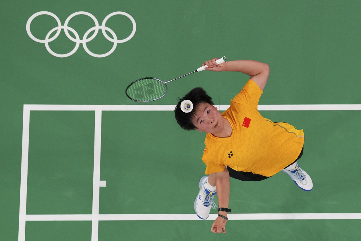 China's He Bingjiao plays against her compatriot Chen Yufei during their women's singles badminton quarterfinal match at the Summer Olympics on Saturday in Paris. 