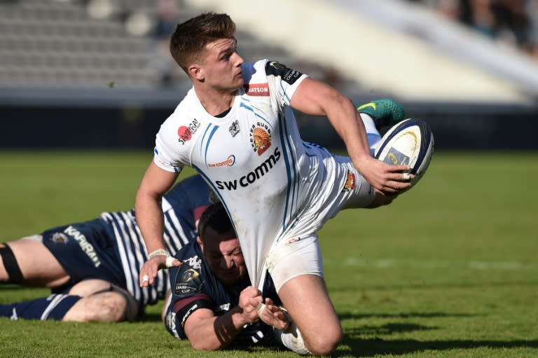 Exeter's fly-half Henry Slade (C) passes the ball during a European Champions Cup rugby union match in Bordeaux, France, in December 2016