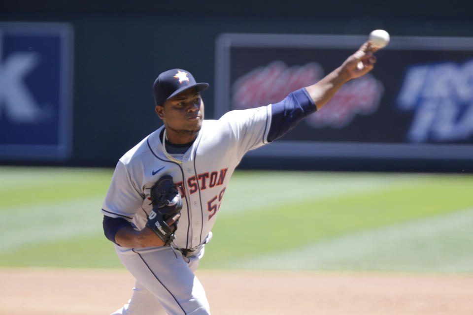 Houston Astros Framber Valdez throws against the Minnesota Twins in the first inning of a baseball game, Sunday, June 13, 2021, in Minneapolis. (AP Photo/Andy Clayton-King)