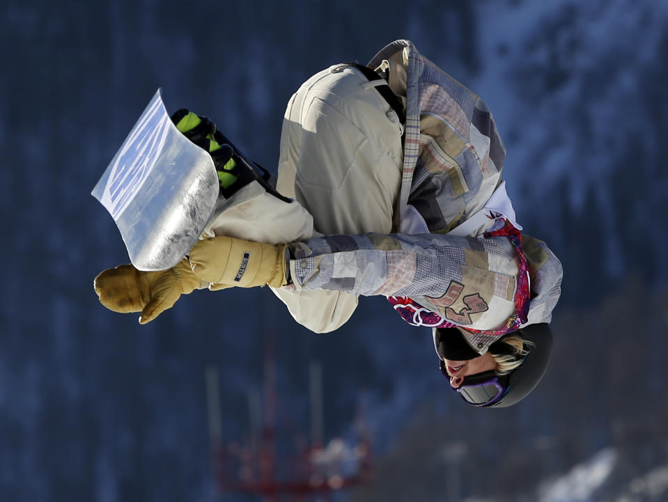 United States' Sage Kotsenburg takes a jump during the men's snowboard slopestyle semifinal at the Rosa Khutor Extreme Park, at the 2014 Winter Olympics, Saturday, Feb. 8, 2014, in Krasnaya Polyana, Russia. (AP Photo/Sergei Grits)