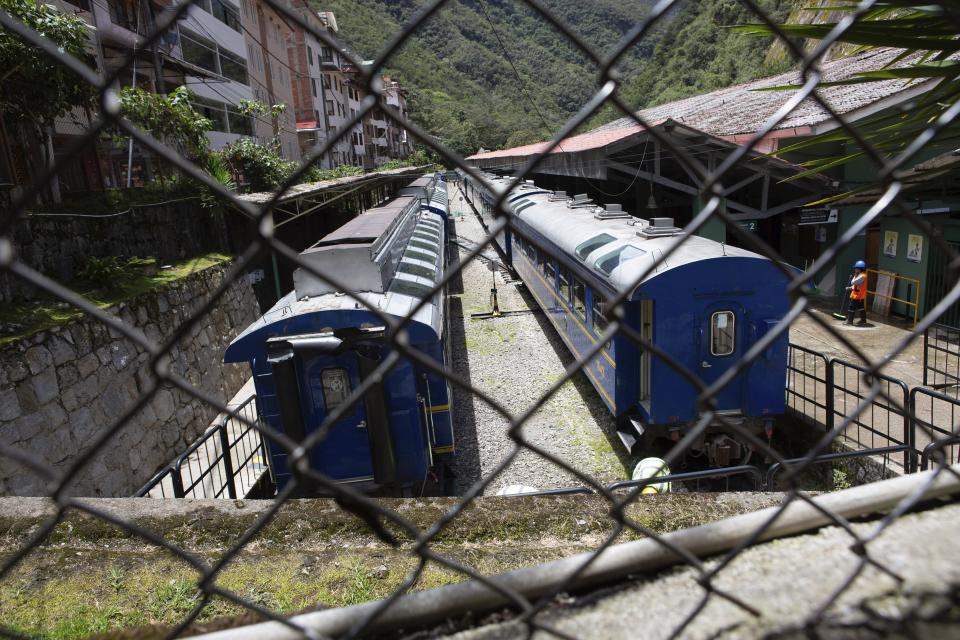 Trains stand idle at the Aguas Calientes train station, near Machu Picchu, in the Cusco department of Peru, Monday, Jan 23, 2023. The Peruvian government has closed Machu Picchu amid deadly anti-government protests that have left hundreds of tourists stranded. (AP Photo/Manuel Orbegoso)