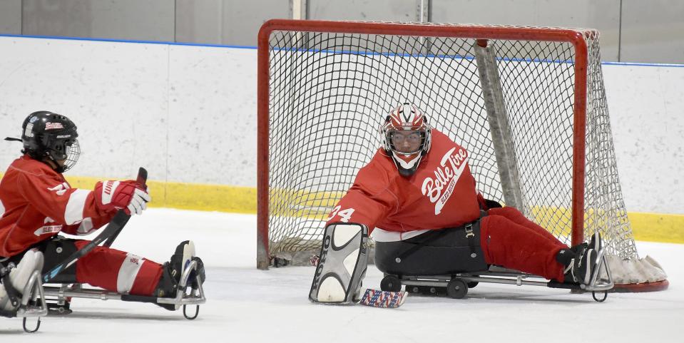 Jordynn Bibb, 14, of Monroe the goalie for the junior Belle Tire Sled Hockey team watches for the putt in the recent tournament Jan. 20, 2024 at Taylor Sportplex.