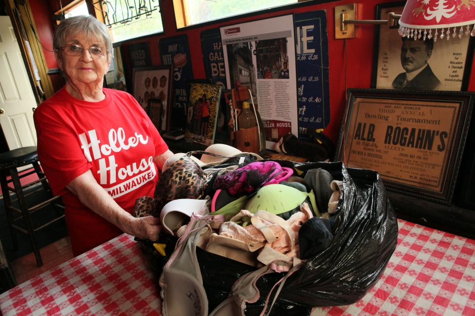 Photo from May 15, 2013. Marcy Skowronski of Holler House Bar at 2042 W. Lincoln Ave, with the bag of bras that once hung from the ceiling but were ordered taken down by a building inspector.