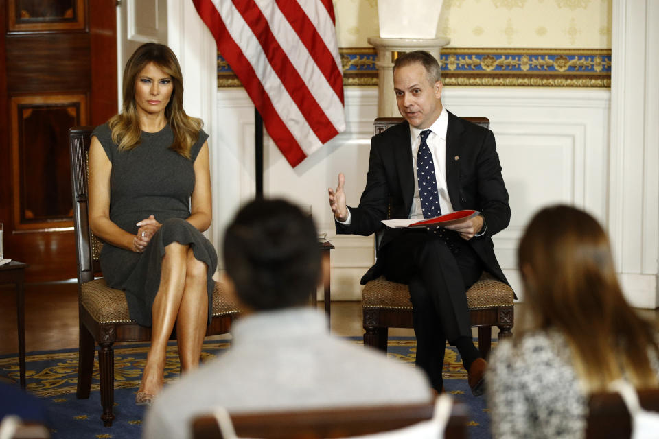 First lady Melania Trump, left, listens as Eric Asche with the Truth Initiative speaks during a listening session with teenagers about their experiences with electronic cigarettes and vaping in the Blue Room of the White House, Wednesday, Oct. 9, 2019, in Washington. (AP Photo/Patrick Semansky)