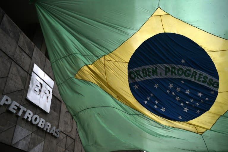 The Brazilian national flag flutters at the front of the headquarters of state oil giant Petrobras, in Rio de Janeiro, Brazil on March 13, 2015