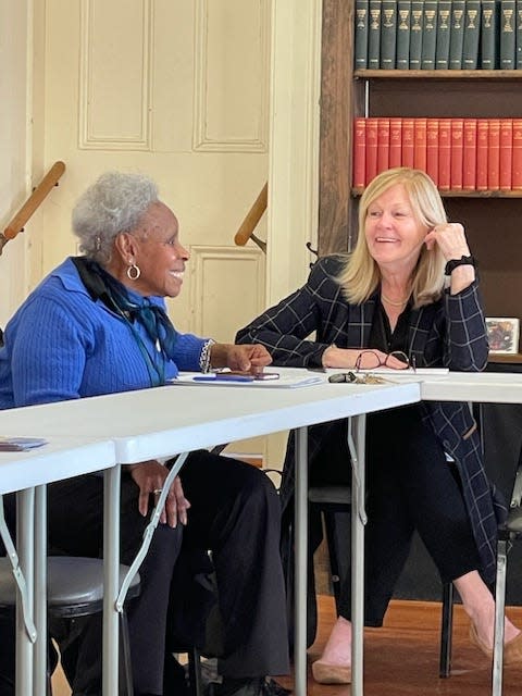 Pauline Perkins-Moye and Katherine Finnegan-Walker, right, char during a Greater Newport Village Steering Committee meeting.