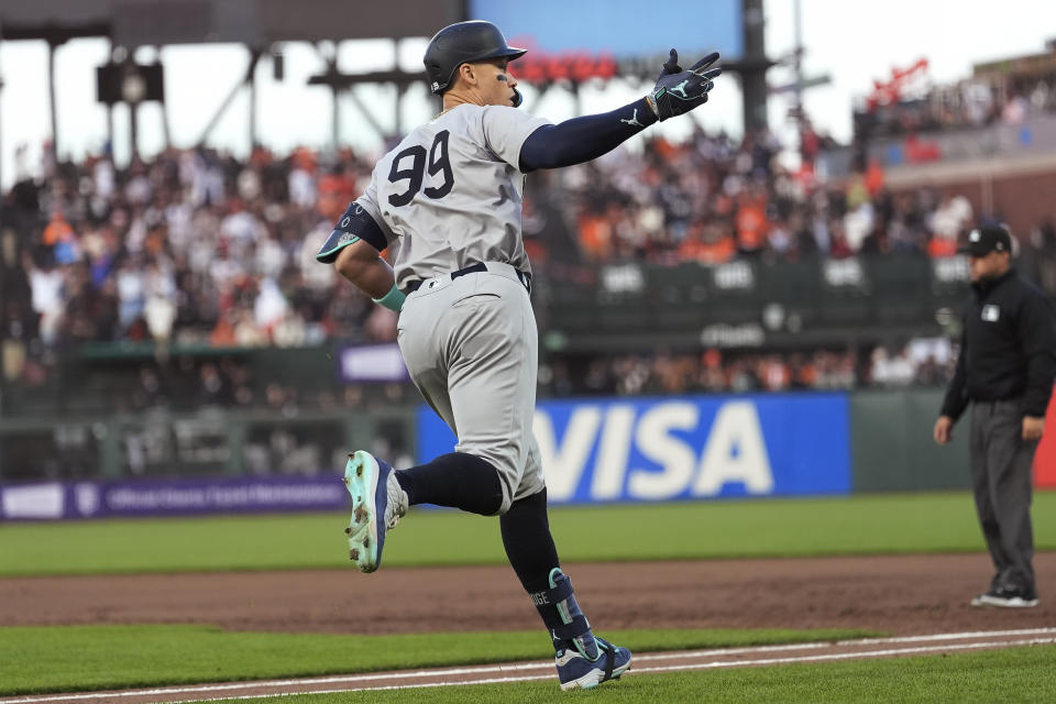 New York Yankees' Aaron Judge (99) gestures after hitting a three-run home run against the San Francisco Giants during the third inning of a baseball game in San Francisco, Friday, May 31, 2024. (AP Photo/Jeff Chiu)