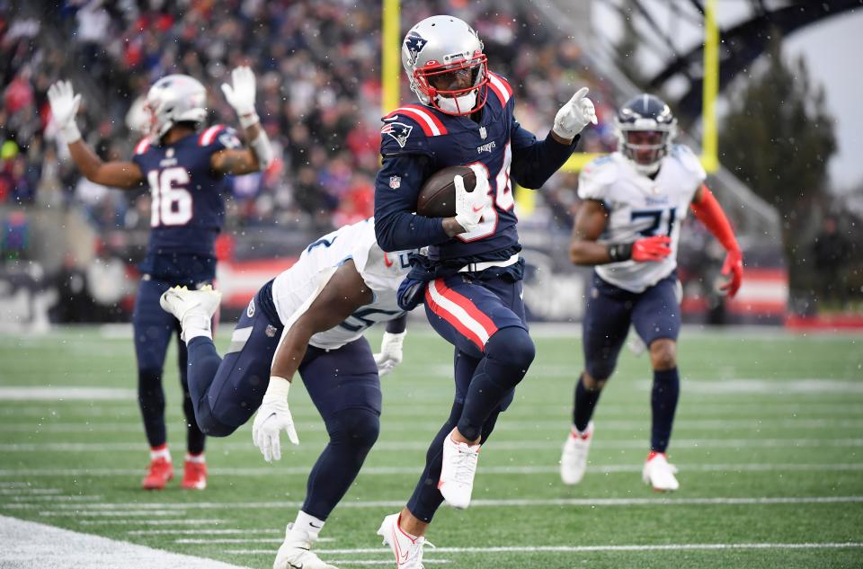 New England Patriots wide receiver Kendrick Bourne runs for a touchdown past Tennessee Titans inside linebacker Jayon Brown  during the second half at Gillette Stadium in Foxboro on Nov. 28, 2021.