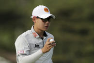 Jazz Janewattananond, of Thailand, reacts after putting on the 15th green during the third round of the PGA Championship golf tournament, Saturday, May 18, 2019, at Bethpage Black in Farmingdale, N.Y. (AP Photo/Charles Krupa)