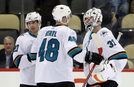 Feb 21, 2019; Pittsburgh, PA, USA; San Jose Sharks right wing Joonas Donskoi (27) and center Tomas Hertl (48) and goaltender Martin Jones (31) celebrate after defeating the Pittsburgh Penguins at PPG PAINTS Arena. San Jose shutout the Penguins 4-0. Mandatory Credit: Charles LeClaire-USA TODAY Sports