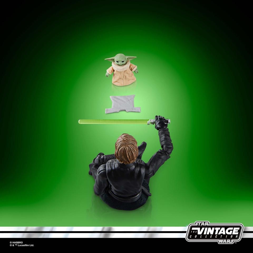 Star Wars Luke and Grogu action figures posed against a green background