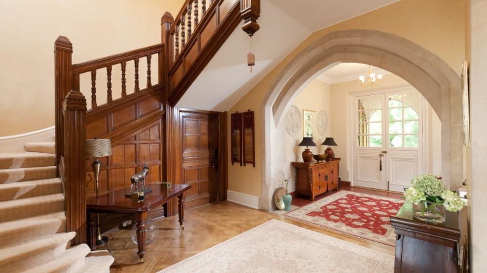 The foyer, which houses the original staircase - Credit: Strutt & Parker