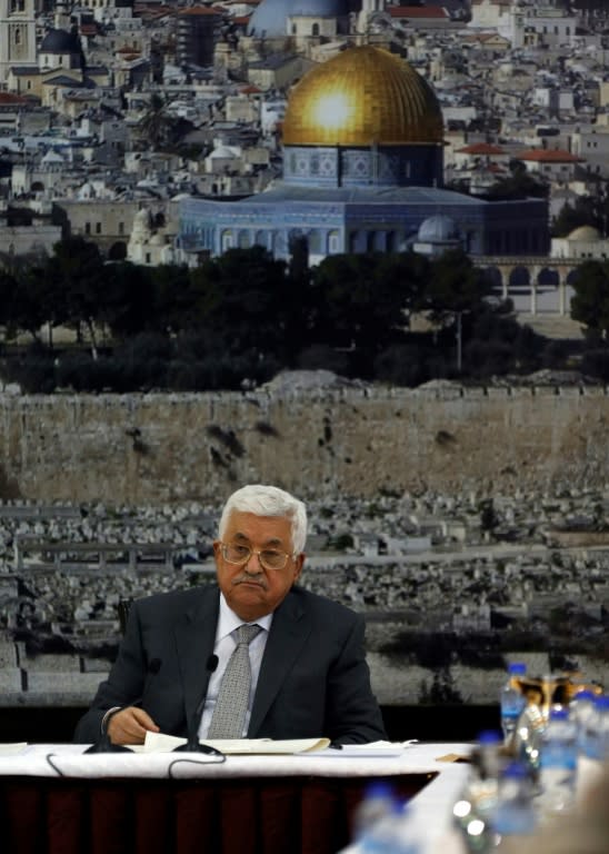 Palestinian president Mahmud Abbas announces he is freezing contacts with Israel in protest at new security measures imposed at Jersualem's Al-Aqsa mosque compound, seen in a photgraph behind him, during a leadership meeting on July 21, 2017