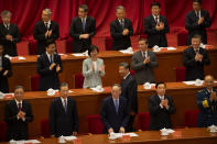 Attendees applaud as Chinese President Xi Jinping walks to his seat at an event to honor some of those involved in China's fight against COVID-19 at the Great Hall of the People in Beijing, Tuesday, Sept. 8, 2020. Chinese leader Xi Jinping is praising China's role in battling the global coronavirus pandemic and expressing support for the U.N.'s World Health Organization, in a repudiation of U.S. criticism and a bid to rally domestic support for Communist Party leadership. (AP Photo/Mark Schiefelbein)