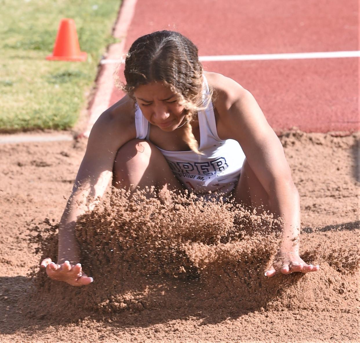 Cooper's Jazlyn Hatcher lands in the long jump during the Region I-5A track and field meet Saturday at Lowrey Field in Lubbock. She finished sixth with a jump of 17 feet, 8 inches.