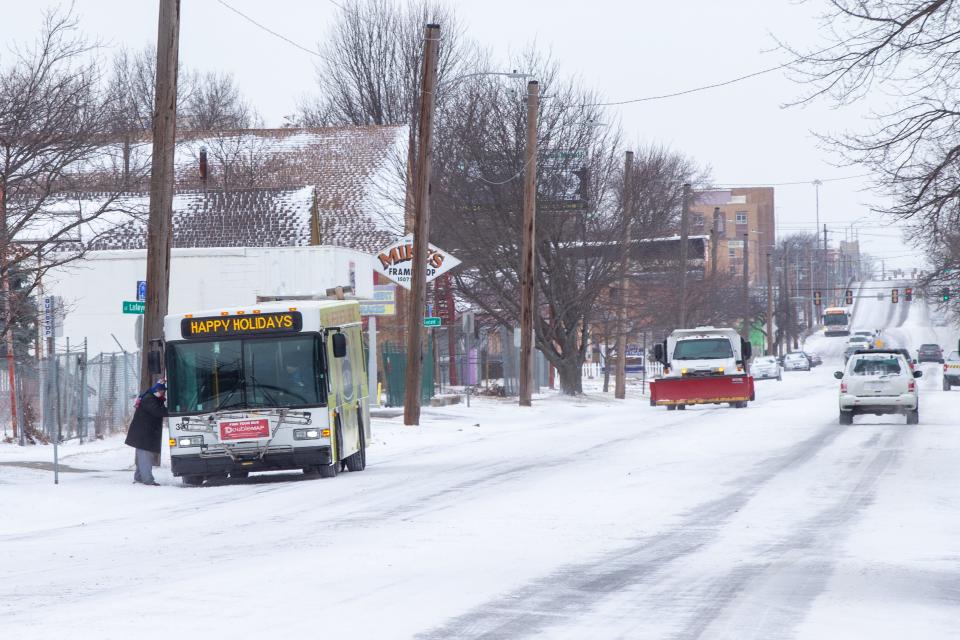 A city bus continued on its route along S.E. 6th Avenue after snow that fell prior to Christmas last year in Topeka. That snow struck around until Christmas Day due to conditions that brought "once-in-a-generation" wind chill indices.