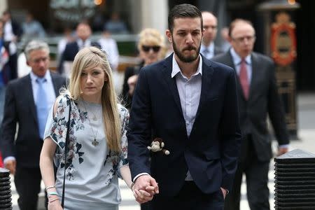 The parents of critically ill baby Charlie Gard, Connie Yates and Chris Gard, arrive at the High Court in London, Britain July 14, 2017. REUTERS/Neil Hall