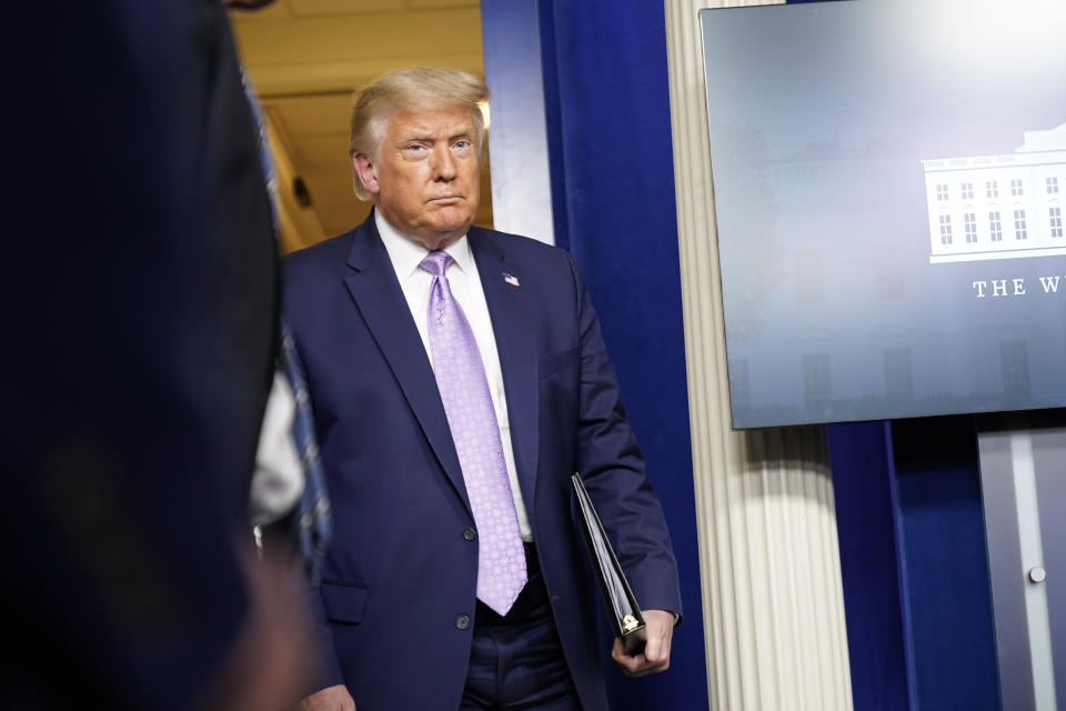 President Donald Trump arrives to speak at a news conference in the James Brady Press Briefing Room at the White House, Thursday, Aug. 13, 2020, in Washington. (AP Photo/Andrew Harnik)