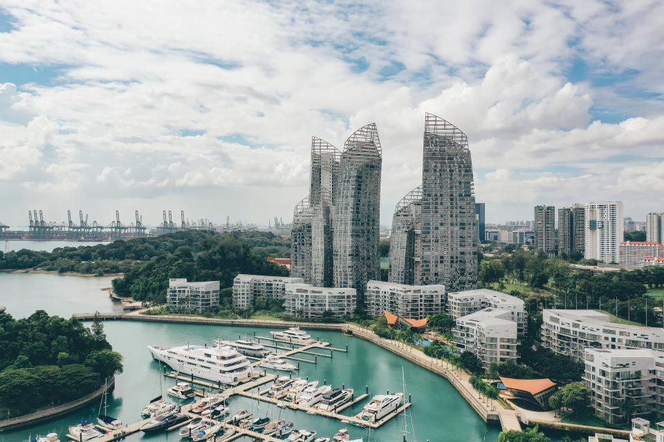 Modern and luxury smart homes in Singapore, seen from above during a hot summer day at the Keppel Bay Yacht Marina area in the city centre.