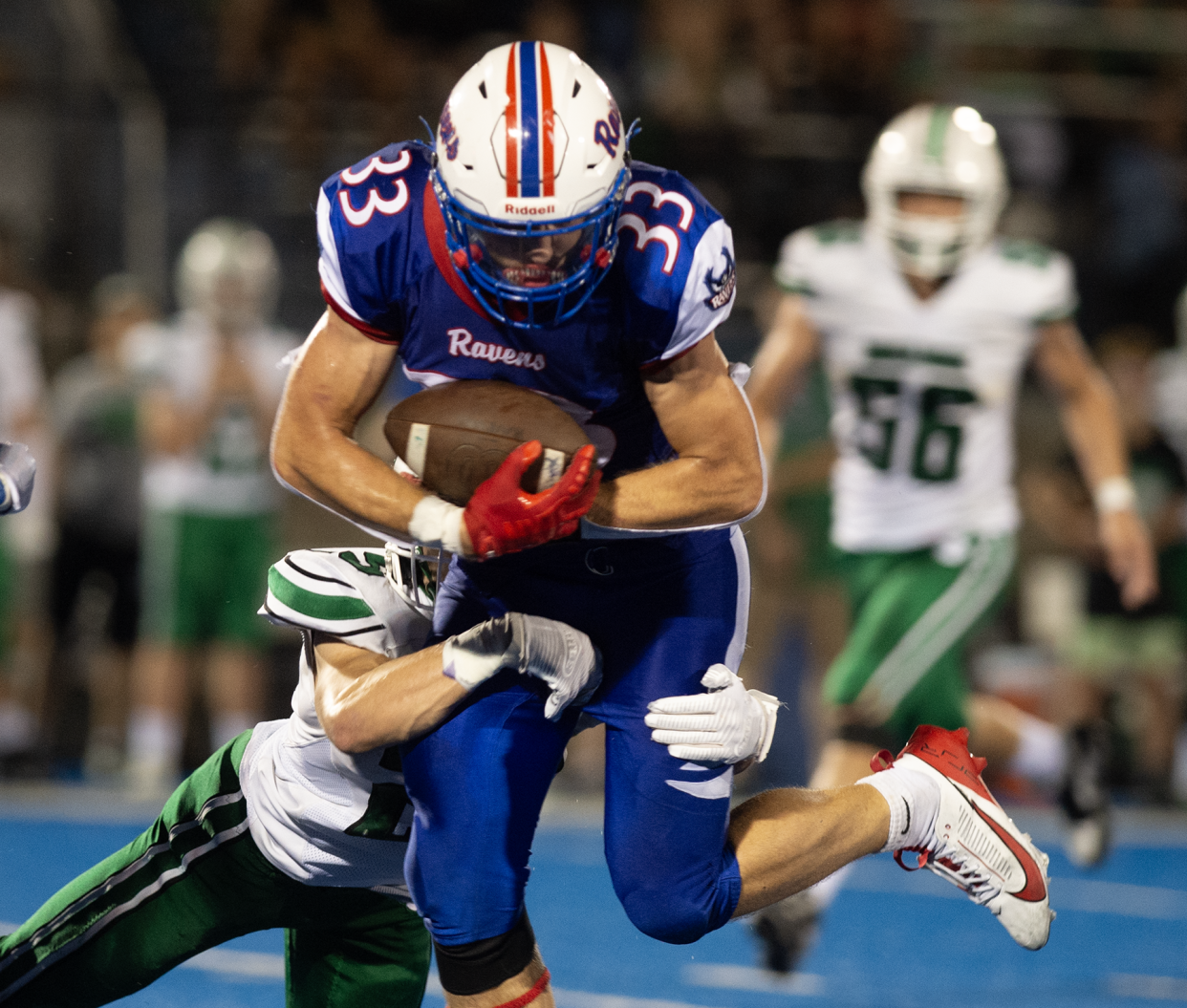 Mogadore's Conner Lehner tackles Ravenna's Robert Melzer as he runs up the field.