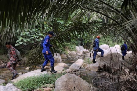 Members of Malaysian rescue team take part in a search and rescue operation for 15-year-old Irish girl Nora Anne Quoirin who went missing from a resort in Seremban.