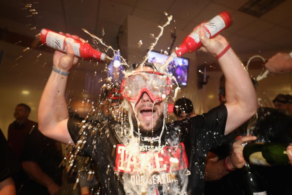 Chris Owings celebrates after the D-backs win. They clinched a wild-card berth Sunday. (Getty Images)