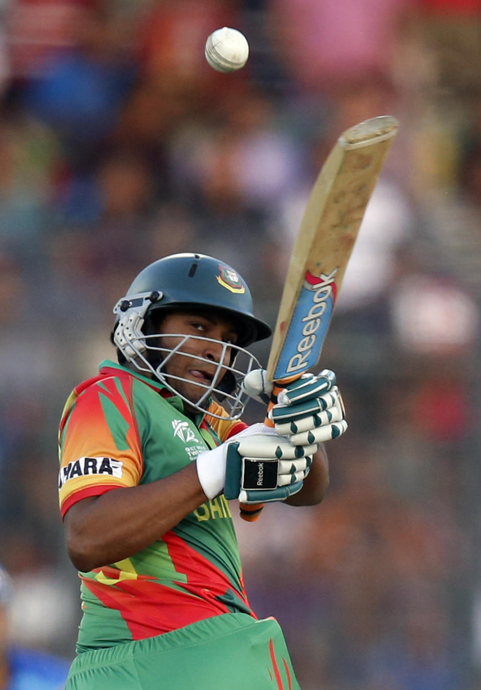Bangladesh's batsman Shakib Al Hasan plays a shot during their ICC Twenty20 Cricket World Cup opening match against Afghanistan in Dhaka, Bangladesh, Sunday, March 16, 2014. (AP Photo/Aijaz Rahi)
