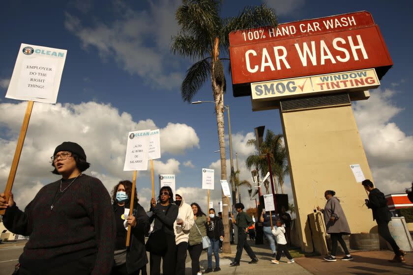 INGLEWOOD, CA - NOVEMBER 29, 2022 - - CLEAN Carwash workers, labor organizations, local clergy and city officials rally outside of Shine N' Brite Car Wash to protest the owner Michael Zarabi's treatment of his employees in Inglewood on November 29, 2022. In the latest crackdown against wage theft in Southern California, state officials said Tuesday they would penalize an Inglewood carwash operator more than $900,000 for paying workers far below the minimum wage and denying them overtime and rest breaks. Over a three-year period that ended in 2021, Shine N Brite carwash paid 15 workers a daily flat rate as low as $70 for eight to 10 hours of work, Labor Commissioner Lilia Garcia-Brower said. During that period, the state minimum wage went from $10.50 an hour to $13 an hour for businesses with 25 or fewer employees. (Genaro Molina / Los Angeles Times)