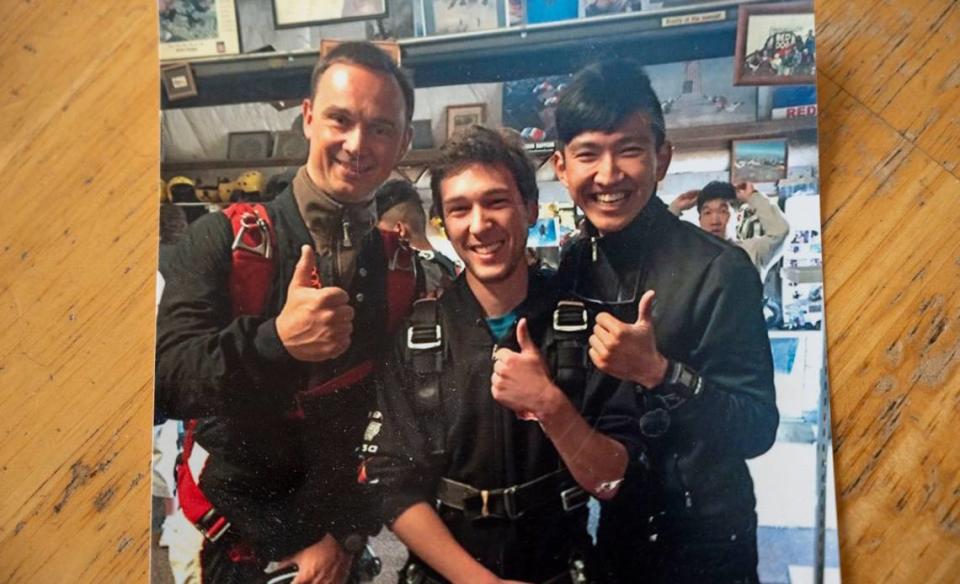 Tyler Turner, center, gives the thumbs-up sign at the Lodi skydiving facility in 2016 before he died in a skydiving accident.