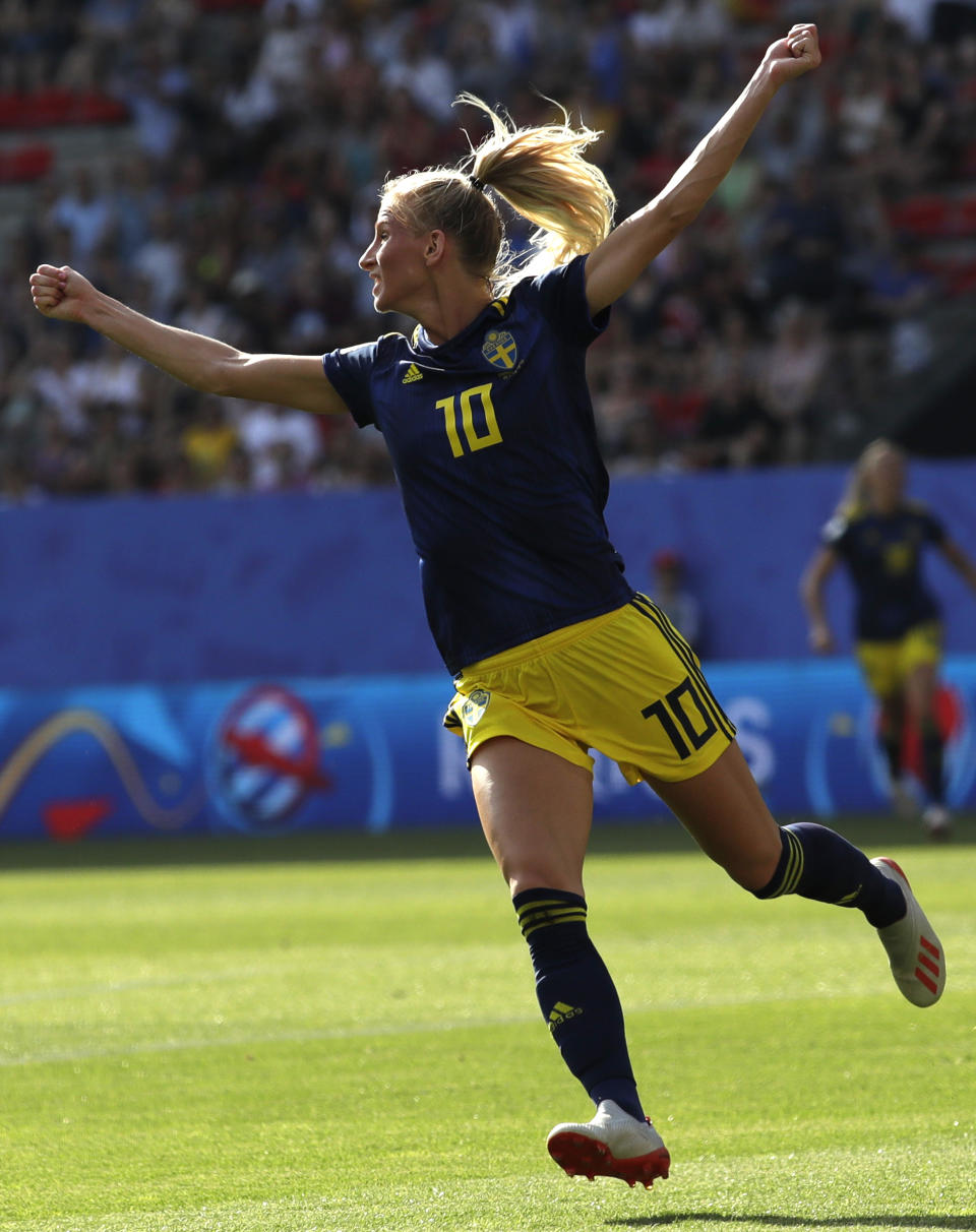 Sweden's Sofia Jakobsson celebrates after scoring her side's opening goal during the Women's World Cup quarterfinal soccer match between Germany and Sweden at Roazhon Park in Rennes, France, Saturday, June 29, 2019. (AP Photo/Alessandra Tarantino)