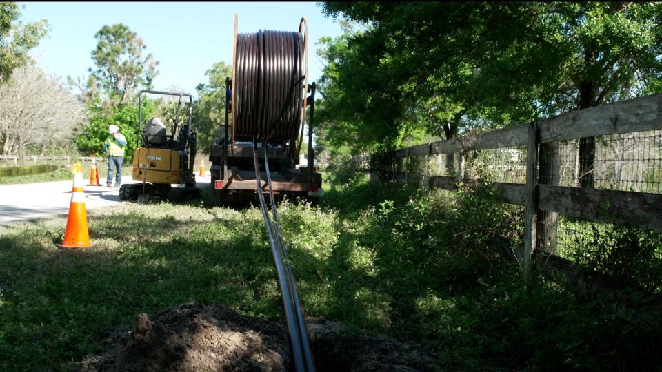 Florida Power & Light crews demonstrated the process of moving power lines underground on February 21, 2024, in Jupiter Farms, Fla.