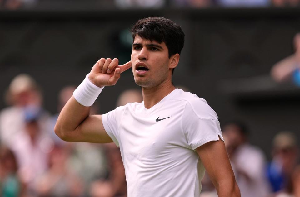 Carlos Alcaraz puts his finger to his ear during his semi-final win (Jordan Pettitt/PA) (PA Wire)