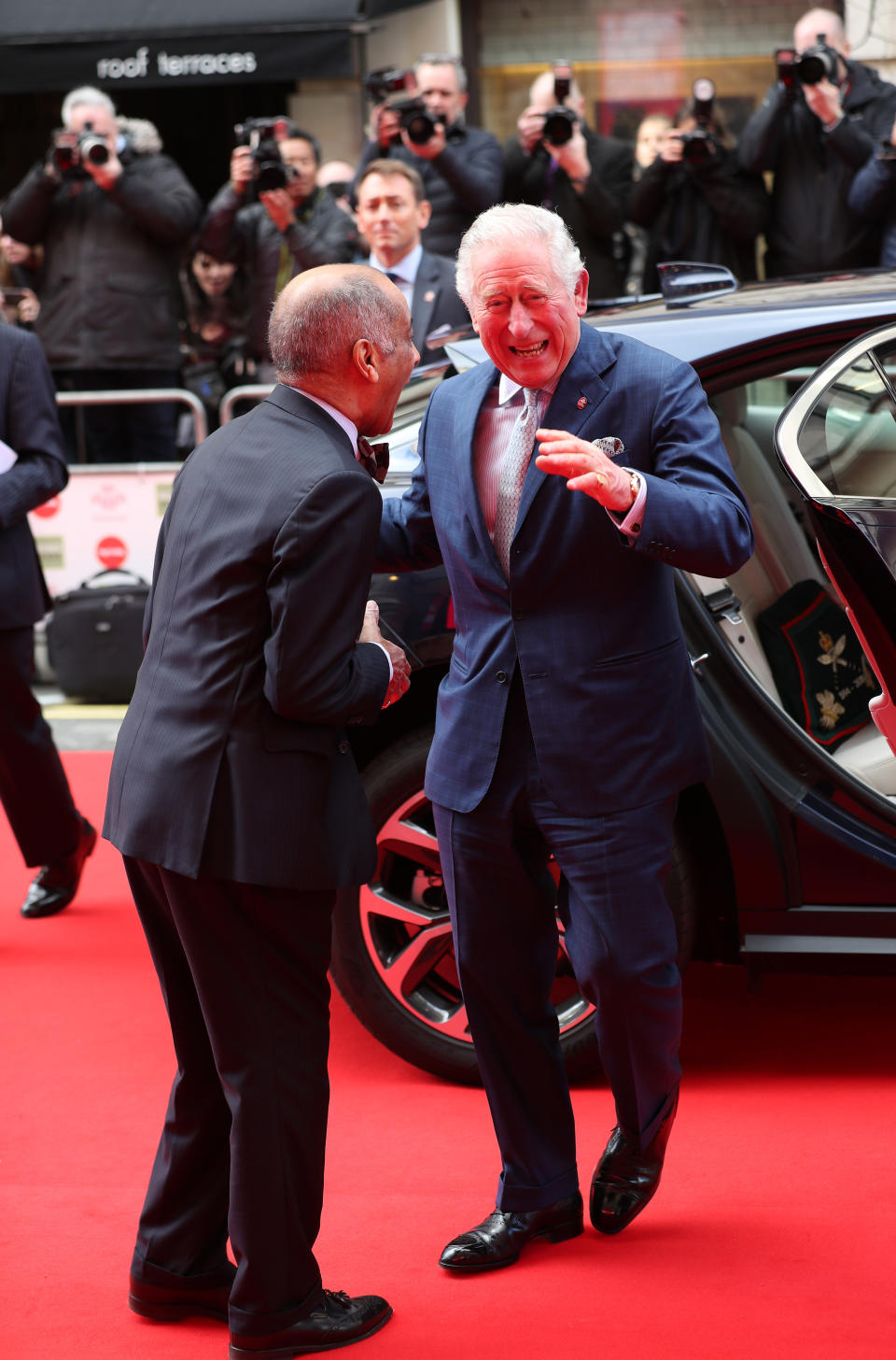 The Prince of Wales goes to shake the hand of Sir Kenneth Olisa, The Lord-Lieutenant of Greater London (left) before he changes to use a Namaste gesture, as he arrives at the annual Prince's Trust Awards 2020 held at the London Palladium.