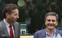 Newly appointed Greek Finance Minister Euclid Tsakalotos (R) is welcomed by Eurogroup President Jeroen Dijsselbloem (L) at a euro zone finance ministers meeting on the situation in Greece in Brussels, Belgium, July 7, 2015. REUTERS/Yves Herman