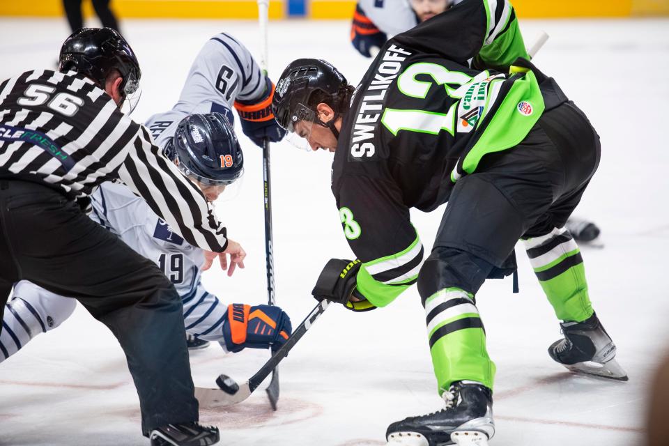 Savannah's Alex Swetlikoff (13) faces off against Greenville's Bryce Reddick (19) during the season opener against the Greenville Swamp Rabbits that resulted in a 5-4 win for the Ghost Pirates at Bon Secours Wellness Arena in Greenville, SC, on Saturday, Oct. 22. 