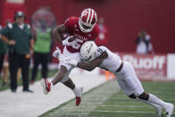 Indiana's Stephen Carr (5) is hit by Michigan State's Donald Williams during the second half of an NCAA college football game, Saturday, Oct. 16, 2021, in Bloomington, Ind. Michigan State won 20-15. (AP Photo/Darron Cummings)