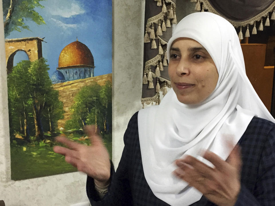 In this photo taken March 21, 2017, Ahlam al-Tamimi is photographed during an interview in her home in the Jordanian capital of Amman. The family of an Israel-American girl killed in a 2001 Palestinian suicide bombing in Jerusalem is seeking a meeting with President Joe Biden in hopes of forcing Jordan to extradite Tamimi, who was convicted in the deadly attack. The parents of Malki Roth sent a letter to the White House on Sunday, July 10, 2022 asking to meet with Biden when he comes to Jerusalem this week. They want the president to put pressure on Jordan, a close American ally, to send Tamimi to the U.S. for trial. (AP Photo/Omar Akour)