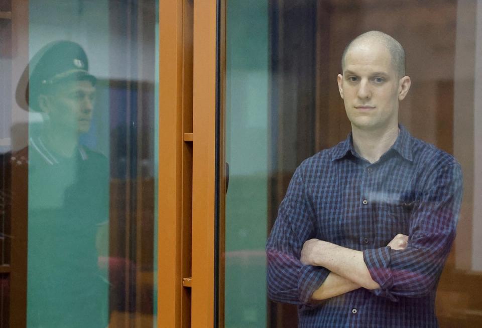 <p>Wall Street Journal reporter Evan Gershkovich, who stands trial on spying charges, is seen inside an enclosure for defendants before a court hearing in Russia</p> (REUTERS)